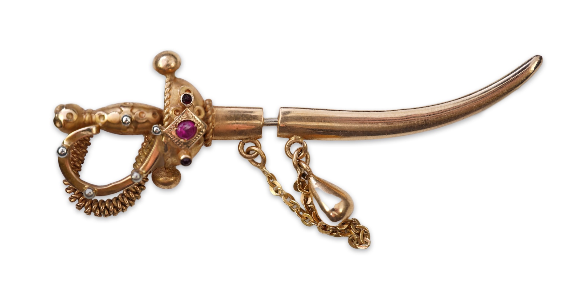 A gold and synthetic ruby jabot pin